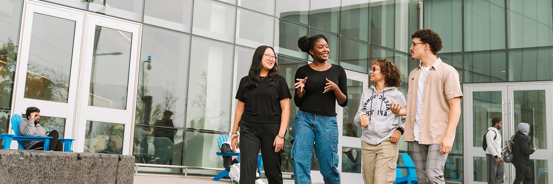 Business students walk in front of University Hall.